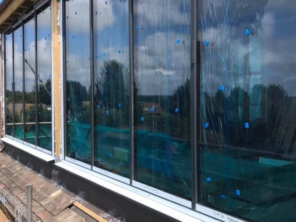 Two story extension and full renovation Construction site with a large mound of earth and a partially demolished house.